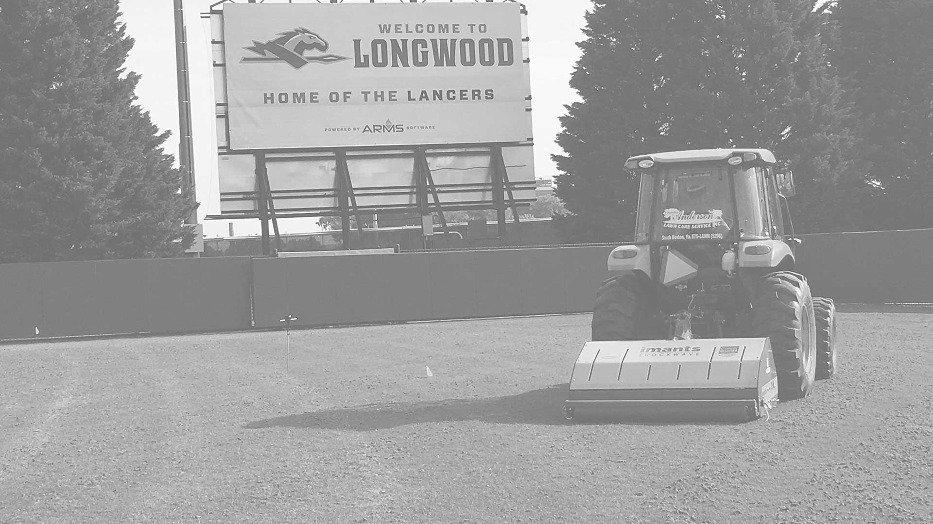 Anderson Turf Management tractor on Longwood field.