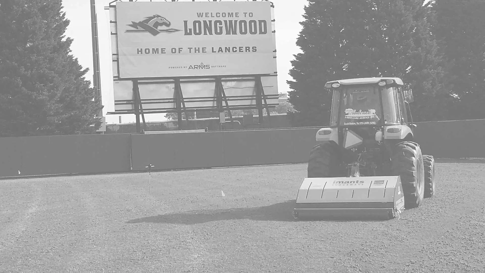 Anderson Turf Management tractor on Longwood field.
