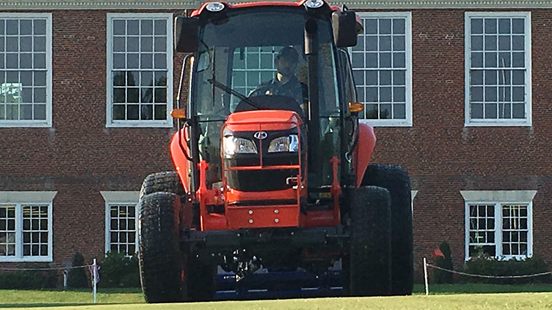 Anderson Turf Management employee in tractor.