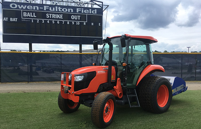 Anderson Turf Management tractor on baseball field.