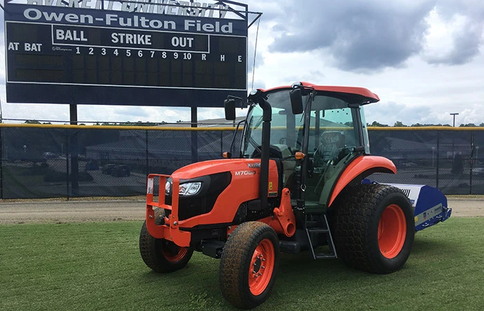 Anderson Turf Management tractor on baseball field.